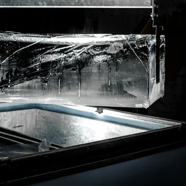 Clear ice cube in glass
